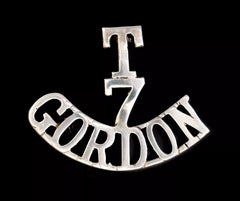 T 7 Gordon Shoulder Title White Metal