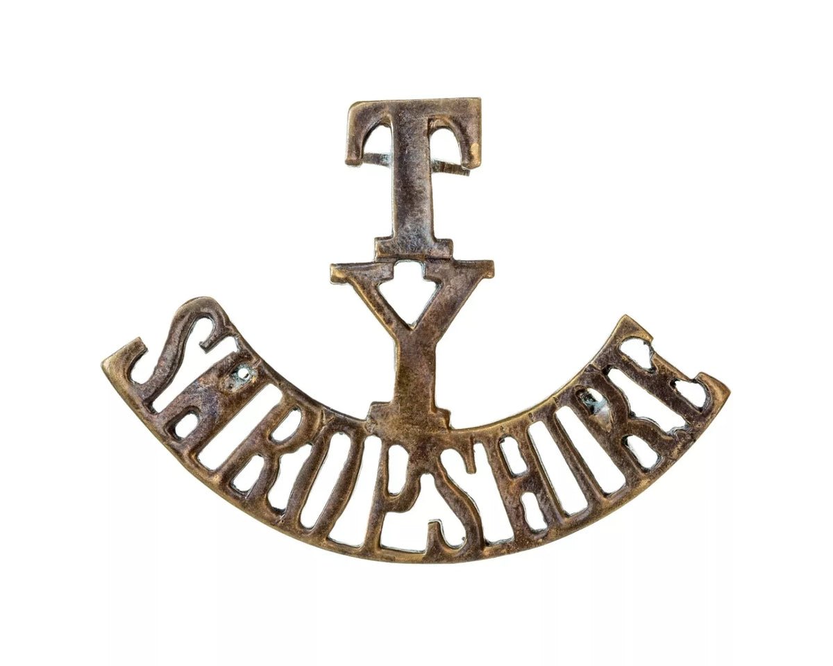 T.Y Shropshire Shoulder Title Brass Metal