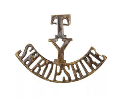 T.Y Shropshire Shoulder Title Brass Metal