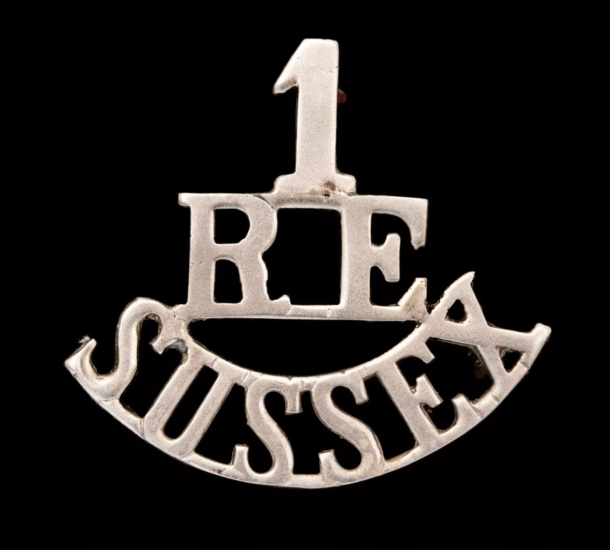 1.R.E Sussex Shoulder Title White Metal